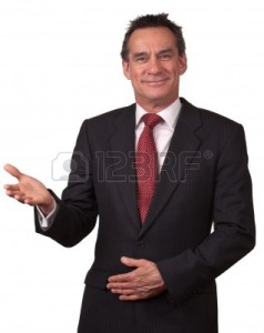 9494707-attractive-middle-age-business-man-in-suit-smiling-welcome
